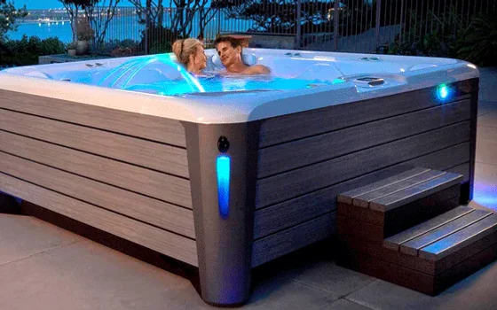 Hot tub installed beside an outdoor terrace
